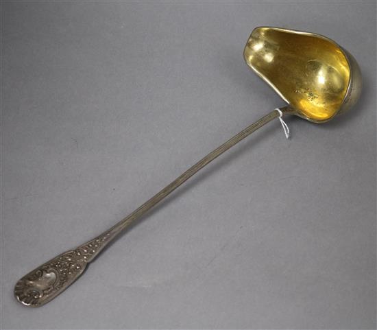 An ornate early 20th century German 800 white metal soup ladle, 8 oz.